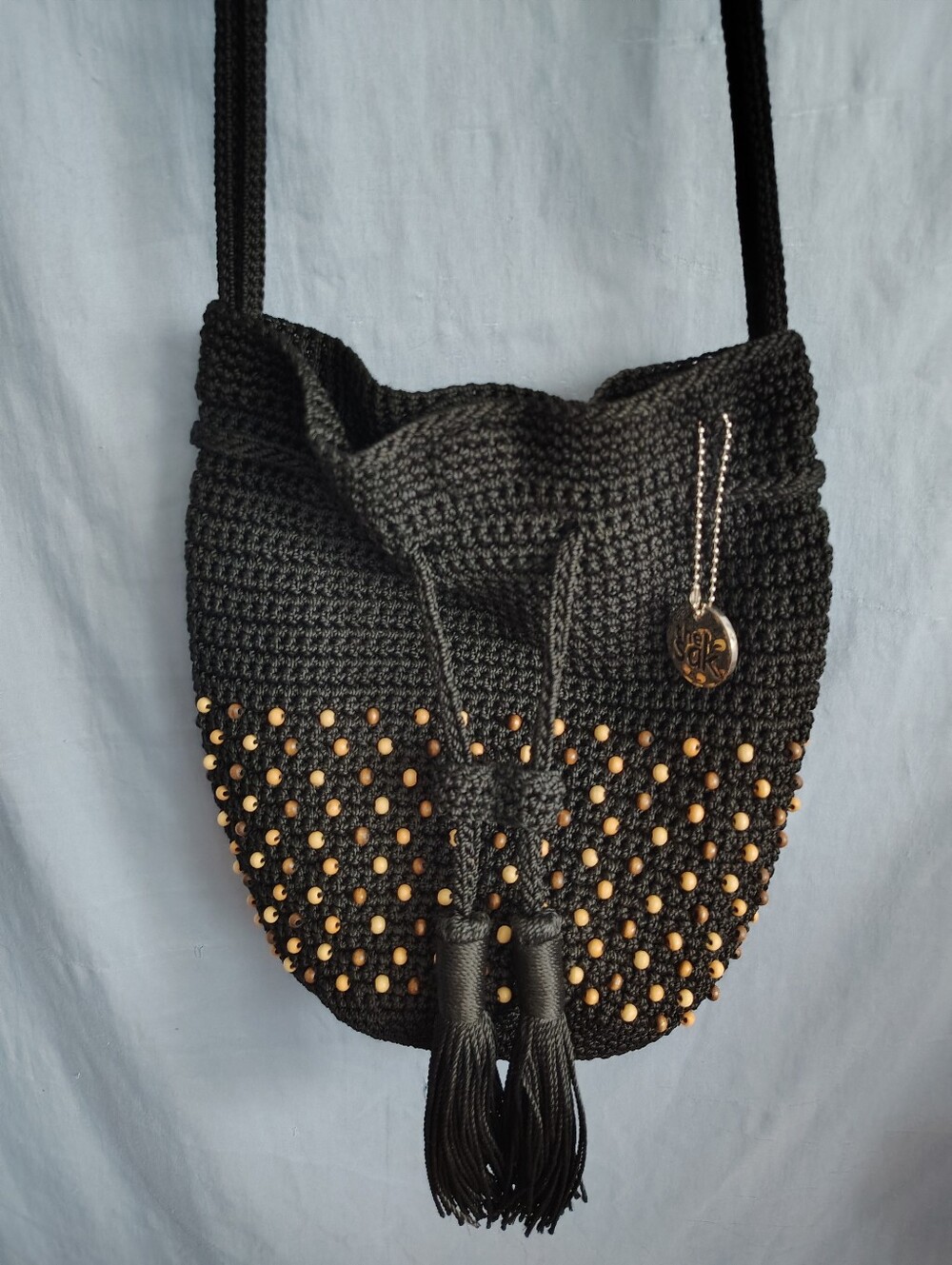 The Sak Black Crochet Crossbody Bag Wood Beads Tassel Drawstring Boho Bali